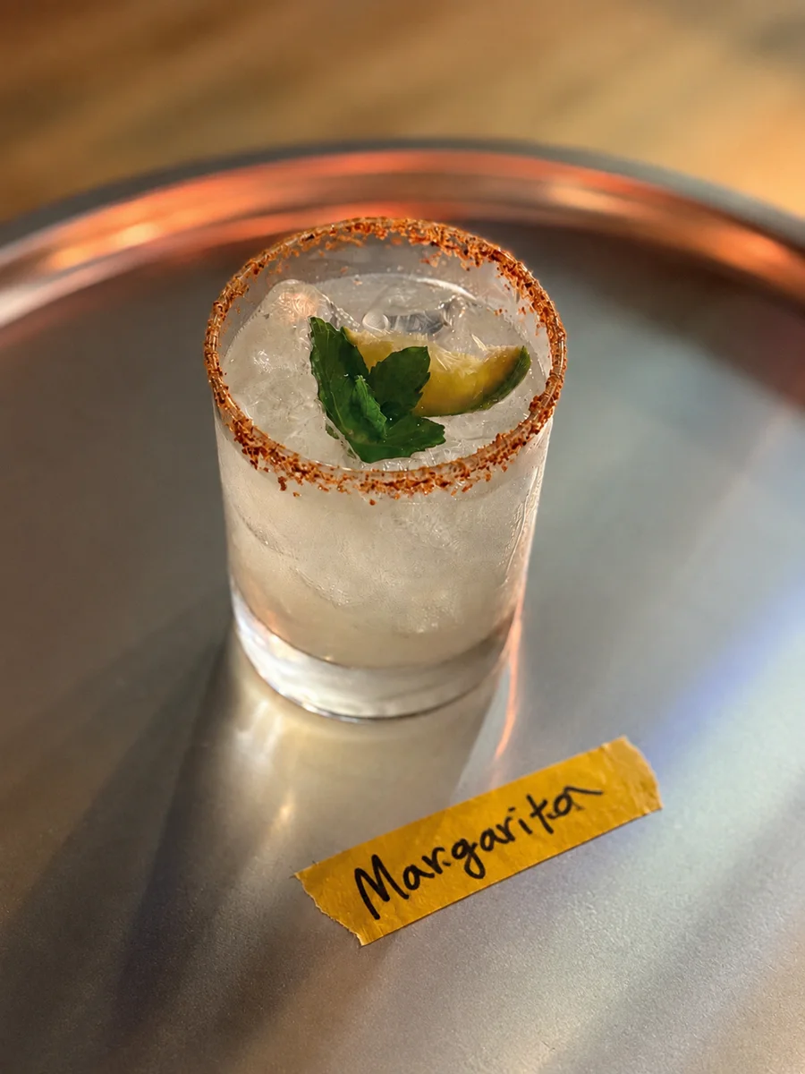 금수강산 Margarita with a Tajín rim on a copper tray